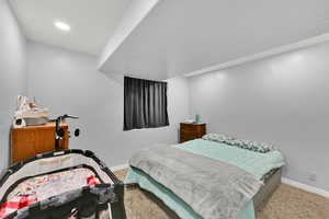 Bedroom with carpet floors and recessed lighting