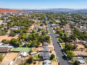 Aerial perspective of suburban area with a mountainous background