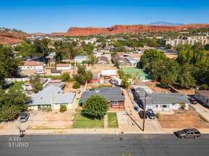 Aerial view of residential area featuring a mountain backdrop