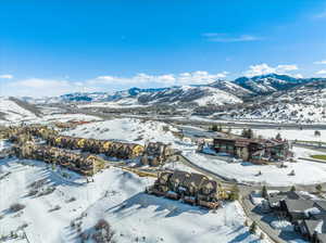 Aerial perspective of suburban area featuring a mountain backdrop