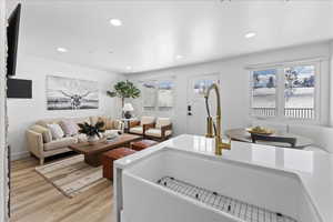 Living room featuring recessed lighting and light wood-style floors