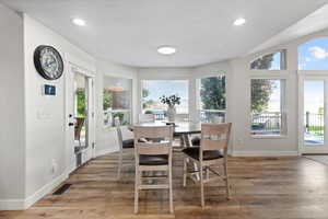 Dining area featuring light wood-style floors and recessed lighting