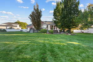 View of property with a Trex deck and stairs