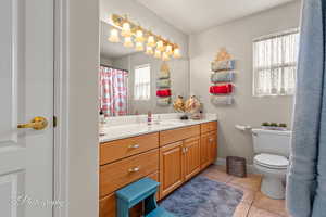 Bathroom featuring vanity and light tile patterned floors