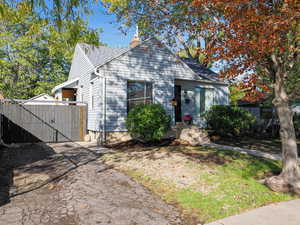 Bungalow-style house featuring a secure gate
