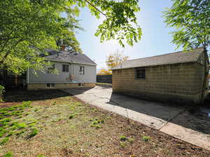 Back of property with view of garage (solar panels are on south aspect)