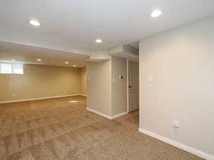 View from "bonus" space to family room area and hallway to bedroom, bath, & laundry