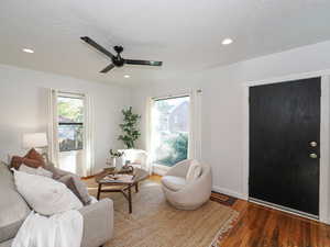 Living area featuring hardwood flooring, recessed lighting, and ceiling fan