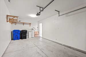 Garage featuring a garage door opener