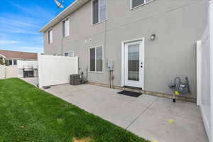 Rear view of property featuring a patio area and stucco siding