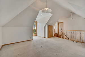 Bonus room featuring lofted ceiling, carpet flooring, and recessed lighting