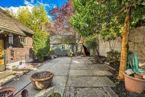 Fenced backyard with a patio area