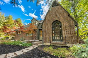View of front facade featuring brick siding