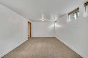 Below grade area with carpet and baseboards