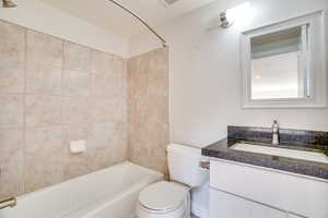 Bathroom with shower / washtub combination and vanity