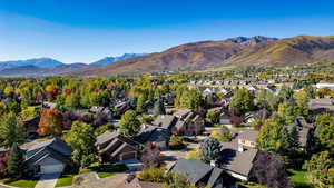 Aerial view of residential area with a mountainous background