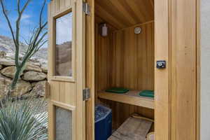 Relaxing sauna / steam room featuring wooden walls and wooden ceiling