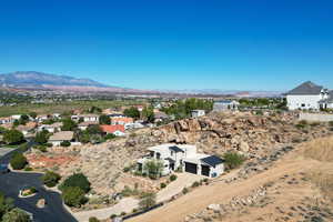 Aerial view of residential area with a mountainous background