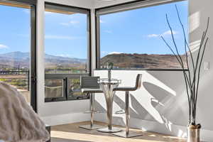 Dining space featuring a mountain view and light wood finished floors