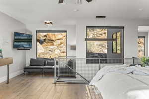 Bedroom featuring light wood-style floors and baseboards