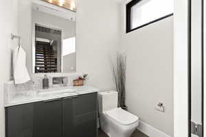 Bathroom featuring toilet and vanity