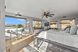 Bedroom with hardwood / wood-style flooring and ceiling fan