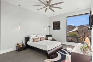 Bedroom featuring ceiling fan and tile patterned flooring