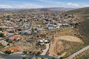 View of property location featuring mountains and nearby suburban area