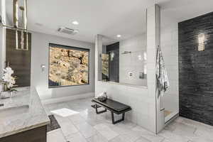 Bathroom with walk in shower, cooling unit, recessed lighting, and double vanity