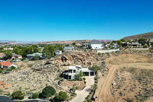 Aerial view of property's location featuring a mountain backdrop