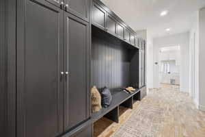 Mudroom featuring recessed lighting and baseboards