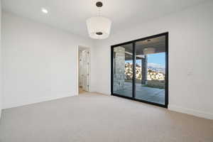 Empty room featuring light carpet and recessed lighting