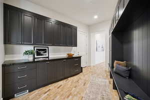 Mudroom featuring light wood-style floors and recessed lighting