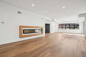 Unfurnished living room with recessed lighting and light wood-style floors
