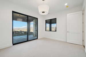 Spare room with light colored carpet and recessed lighting