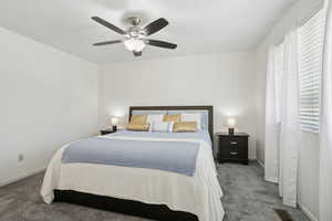 Bedroom with carpet and ceiling fan