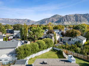 View of mountain backdrop featuring nearby suburban area