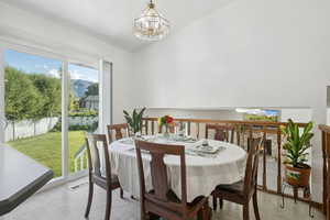Dining room featuring a chandelier and light flooring