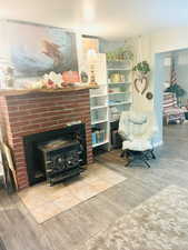 Living area featuring light wood-style floors and baseboards