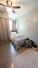 Bedroom featuring wood finished floors and ceiling fan