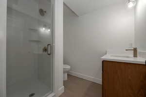 Bathroom with vanity and a shower stall