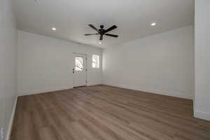 Empty room with recessed lighting, light wood-style floors, and ceiling fan