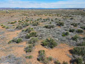 View of rural area featuring mountains and a desert landscape