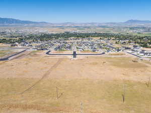 View of property location with a mountainous background and nearby suburban area