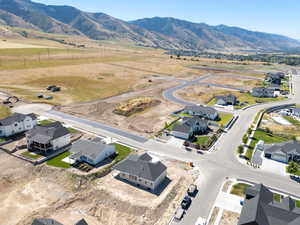 Aerial perspective of suburban area featuring a mountain backdrop