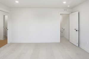 Unfurnished bedroom with baseboards and recessed lighting