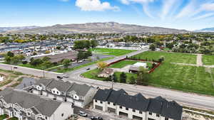 Aerial view of residential area featuring a mountainous background