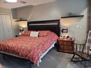 Bedroom featuring carpet, a closet, and ceiling fan