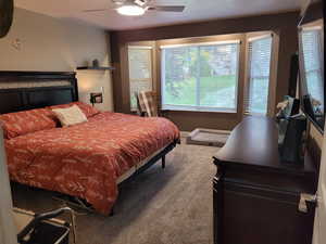 Bedroom with carpet and ceiling fan