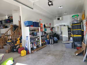Garage with a heating unit and a garage door opener